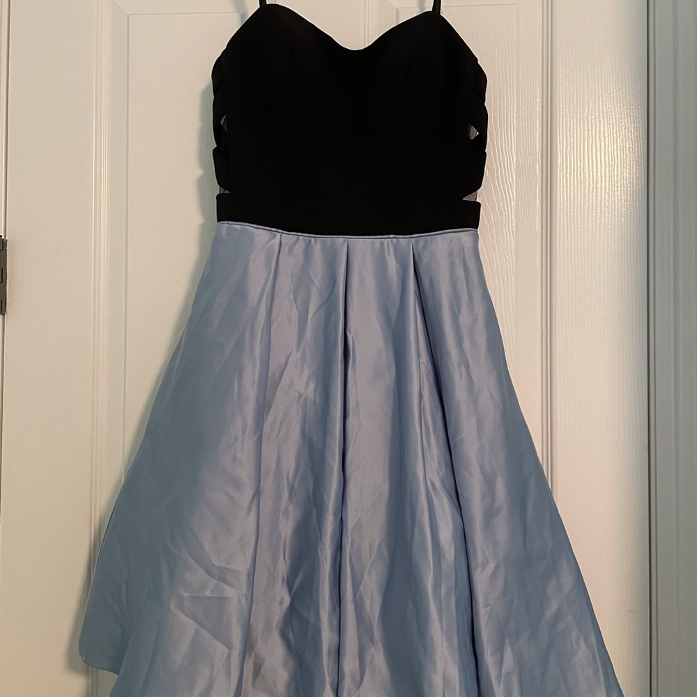 strapless blondie nites dress with light blue bottom half and black upper half